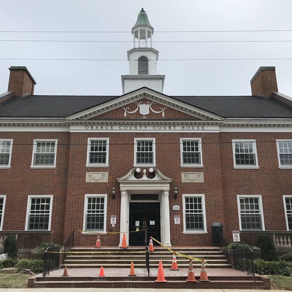 Skilled technician from Septic Innovations performing a septic system installation in Orange County