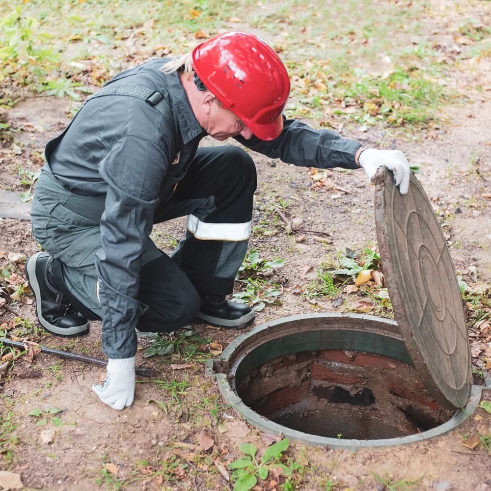 Experienced technician from Septic Innovations performing a thorough septic inspection in a North Carolina home