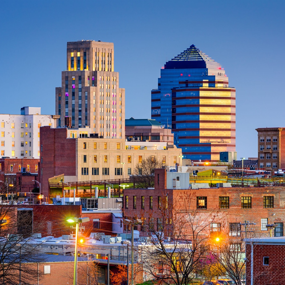 Expert technician from Septic Innovations performing maintenance on a septic system in Durham County, ensuring optimal functionality