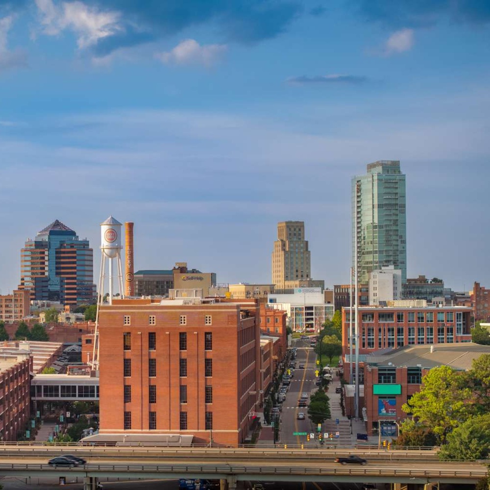 Dependable Septic Innovations technician inspecting a septic tank in Durham County, demonstrating expertise and care