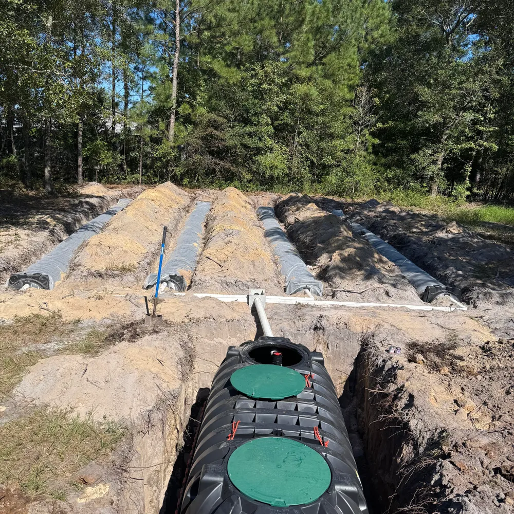 Expert technician from Septic Innovations conducting septic repair in a North Carolina residence