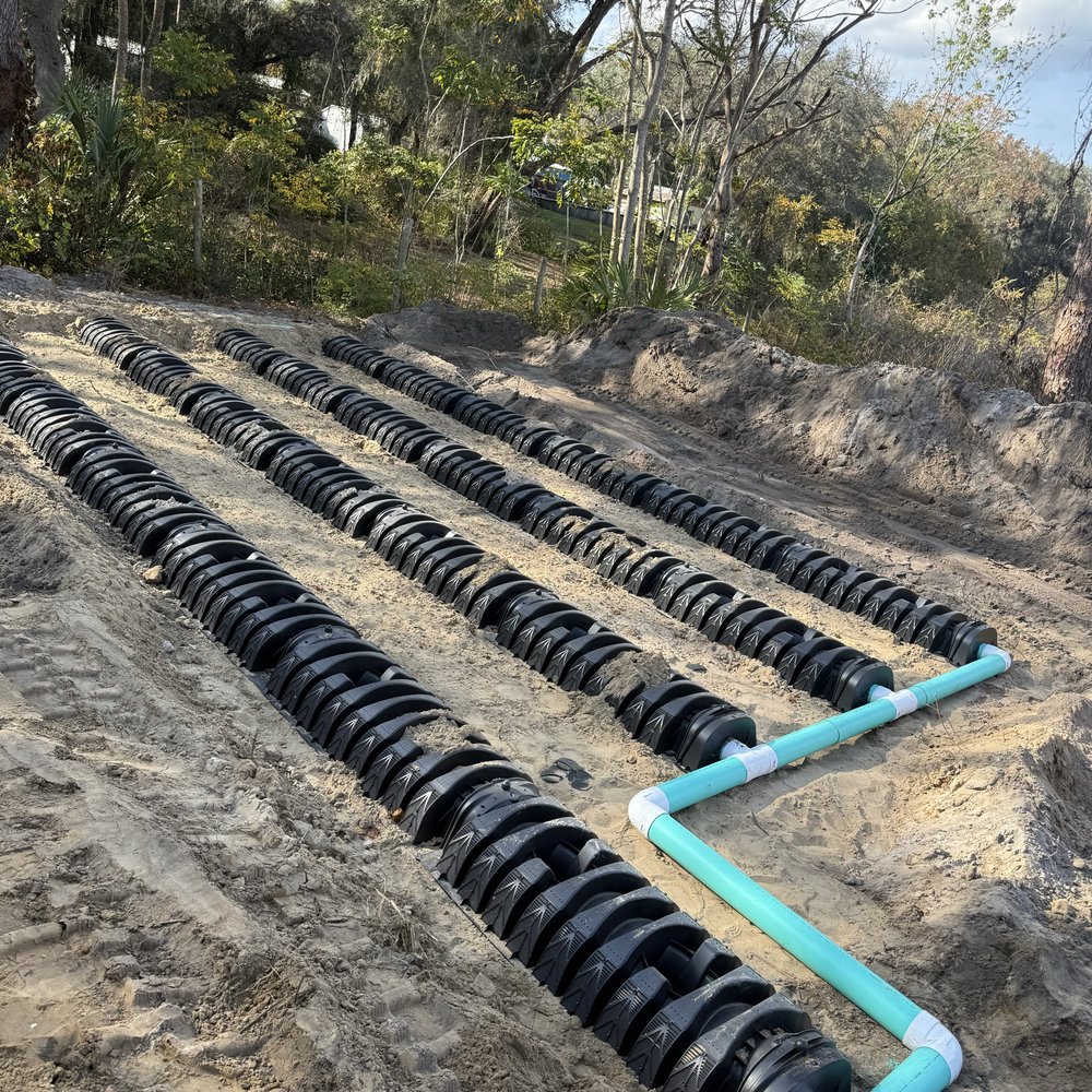 Certified technician from Septic Innovations inspecting septic system in North Carolina, ensuring high performance and compliance
