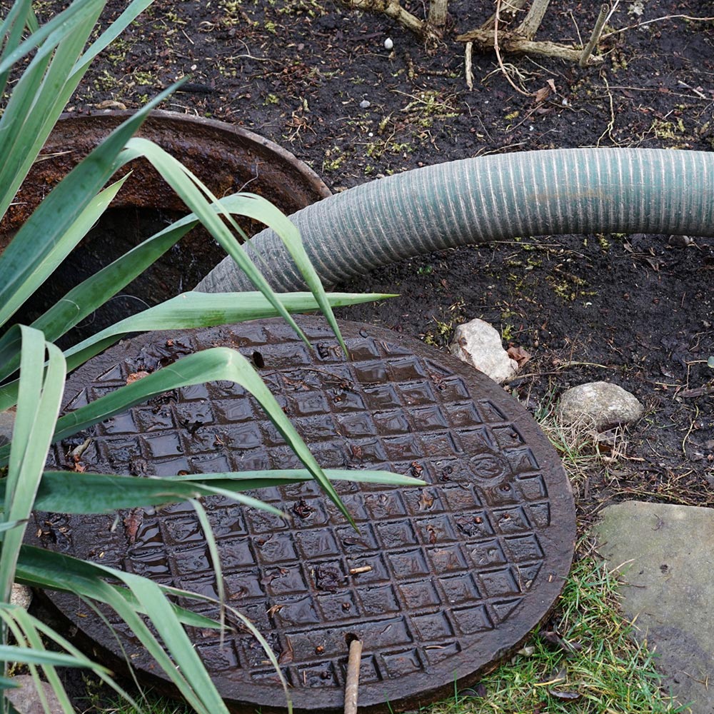 Technician using advanced equipment for meticulous septic drain cleaning ensuring health and safety in North Carolina