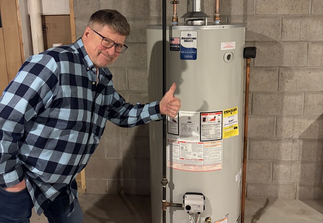 Heating technician repairing a residential boiler system during a service call in wiconsin